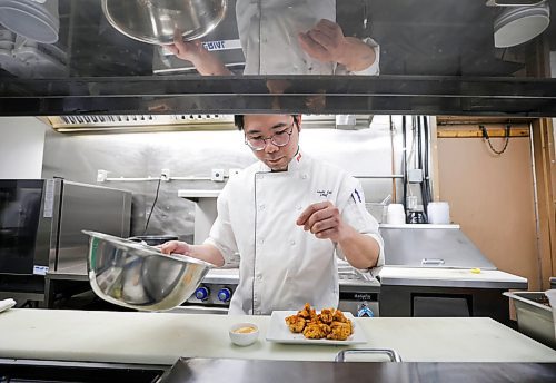RUTH BONNEVILLE / WINNIPEG FREE PRESS 

ENT - Aroma Bistro

Photo of Chef Louie Lui putting the finishing touches on Aroma LalLa Chicken in his kitchen. 

Story on Aroma Bistro for an upcoming Tasting Notes feature on the Asian fusion restaurant known for their wide selection of handmade wontons. Chef Louie Lui will be highlighting some of their most popular dumpling dishes.

Eva Wasney


Feb 27th,  2023