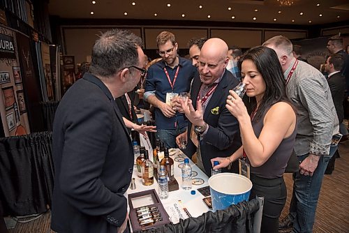 DAVID LIPNOWSKI / WINNIPEG FREE PRESS

Margaret Cunha and Kerry Wolfe speak with Gary McLoughlin of Glendalough during the 2017 Winnipeg Whiskey Festival Friday March 3, 2017 at the Fairmont Hotel.