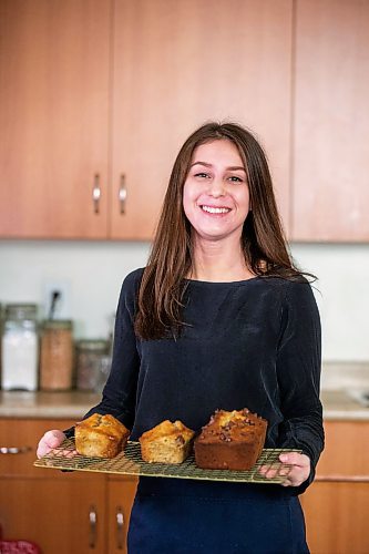 MIKAELA MACKENZIE / WINNIPEG FREE PRESS

Cassandra Hoefer, owner of Bread Habits, poses for a photo with some of her famous banana bread in her home in Winnipeg on Wednesday, March 1, 2023. For Dave Sanderson Piche story.

Winnipeg Free Press 2023.