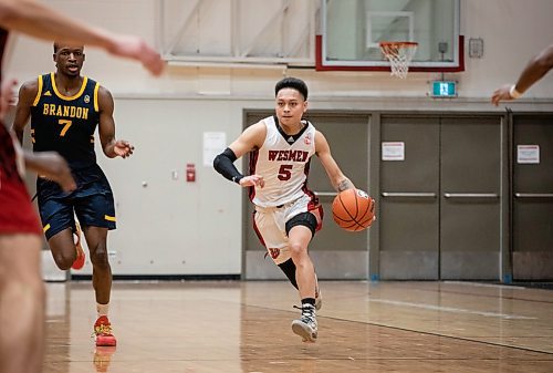 JESSICA LEE / WINNIPEG FREE PRESS

University of Winnipeg Wesmen player Shawn Maranan (5) dribbles the ball during a game against the University of Brandon Bobcats at Duckworth Centre on December 29, 2022.

Reporter: Mike Sawatzky