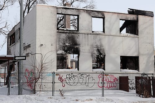 Tyler Searle / Winnipeg Free Press

The remains of a vacant apartment at 160 Mayfair Ave. on March 1, 2023. The building burned May 28, 2022, and has been sitting untouched since. The property owner says he wants to tear it down but does not have plans in place to rebuild and wait lists for demolition companies are months long. 