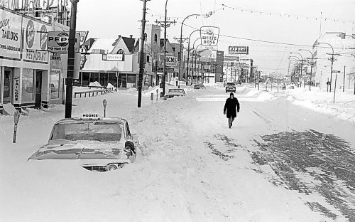 WINNIPEG FREE PRESS ARCHIVES

- view looking west on Portage Avenue from March 4, 1966, a day when the city was walloped by a snowstorm of historic proportions. The blizzard lasted for hours, with snow piles reaching the top of roofs in some areas of the city.