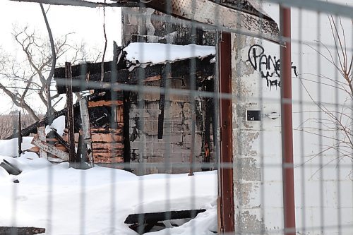 Tyler Searle / Winnipeg Free Press

The remains of a vacant apartment at 160 Mayfair Ave. on March 1, 2023. The building burned May 28, 2022, and has been sitting untouched since. The property owner says he wants to tear it down but does not have plans in place to rebuild and wait lists for demolition companies are months long. 