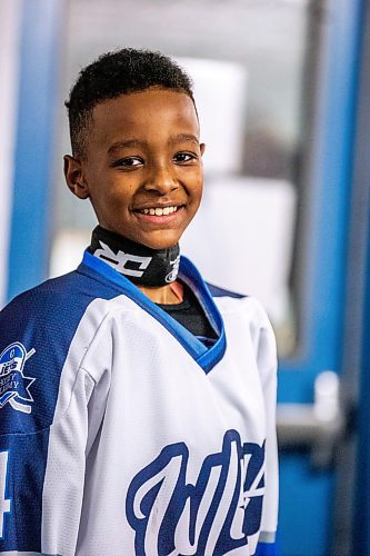 MIKAELA MACKENZIE / WINNIPEG FREE PRESS

Mikli Gemechu, center on the U13 WJHA hockey team, poses for a photo before a game at the Osborne Recreation Centre in Winnipeg on Wednesday, March 1, 2023. He was born in Winnipeg, two years after his family arrived in Canada from Ethiopia, and learned to play hockey thanks to the folks at Winnipeg Newcomer Sport Academy. 
For AV Kitching story.

Winnipeg Free Press 2023.
