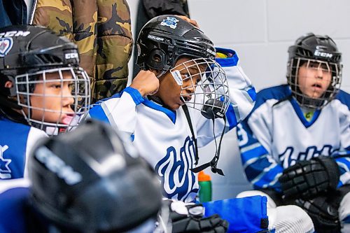 MIKAELA MACKENZIE / WINNIPEG FREE PRESS

Mikli Gemechu, center on the U13 WJHA hockey team, gets ready for a game at the Osborne Recreation Centre in Winnipeg on Wednesday, March 1, 2023. He was born in Winnipeg, two years after his family arrived in Canada from Ethiopia, and learned to play hockey thanks to the folks at Winnipeg Newcomer Sport Academy. 
For AV Kitching story.

Winnipeg Free Press 2023.