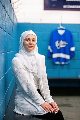 MIKAELA MACKENZIE / WINNIPEG FREE PRESS

Rahaf Abdul Karim, 13, poses for a photo after her hockey game at the Allard Arena in Winnipeg on Wednesday, March 1, 2023. She arrived in Winnipeg as a Syrian refugee together with her parents around five years ago. For AV Kitching story.

Winnipeg Free Press 2023.