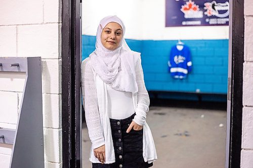 MIKAELA MACKENZIE / WINNIPEG FREE PRESS

Rahaf Abdul Karim, 13, poses for a photo after her hockey game at the Allard Arena in Winnipeg on Wednesday, March 1, 2023. She arrived in Winnipeg as a Syrian refugee together with her parents around five years ago. For AV Kitching story.

Winnipeg Free Press 2023.