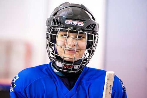 MIKAELA MACKENZIE / WINNIPEG FREE PRESS

Rahaf Abdul Karim, 13, poses for a photo after her hockey game at the Allard Arena in Winnipeg on Wednesday, March 1, 2023. She arrived in Winnipeg as a Syrian refugee together with her parents around five years ago. For AV Kitching story.

Winnipeg Free Press 2023.