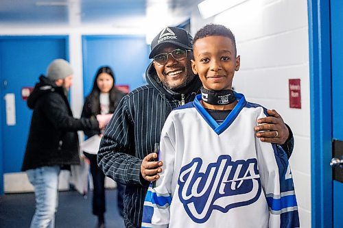 MIKAELA MACKENZIE / WINNIPEG FREE PRESS

Mikli Gemechu, center on the U13 WJHA hockey team, poses for a photo with his dad Abu Gemechu before a game at the Osborne Recreation Centre in Winnipeg on Wednesday, March 1, 2023. He was born in Winnipeg, two years after his family arrived in Canada from Ethiopia, and learned to play hockey thanks to the folks at Winnipeg Newcomer Sport Academy. 
For AV Kitching story.

Winnipeg Free Press 2023.