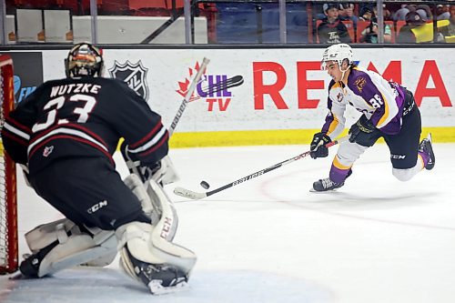 Dawson Pasternak (88) of the Brandon Wheat Kings takes a shot on goalie Chase Wutzke (33) of the Red Deer Rebels during Western Hockey League action at Westoba Place on Friday evening. See story on Page B1. (Tim Smith/The Brandon Sun)