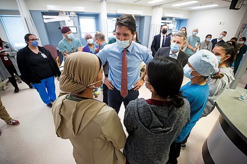 MIKE DEAL / WINNIPEG FREE PRESS
Prime Minister, Justin Trudeau, along with Kevin Lamoureux (left), MP for Winnipeg North, and Terry Duguid (right), MP for Winnipeg South, visit health care workers at the Grace Hospital Friday afternoon.
230303 - Friday, March 03, 2023.