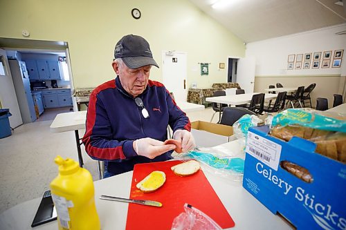 MIKE DEAL / WINNIPEG FREE PRESS
Campbell McIntyre, 75, volunteers with numerous organizations including Gifts of Grace Street Mission, Rainbow Stage and his church, St. Saviours Anglican, where he was making sandwiches Thursday afternoon.
230302 - Thursday, March 02, 2023.