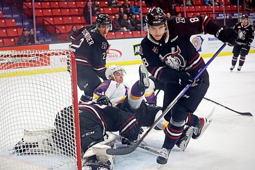 03032023
Dawson Pasternak #88 of the Brandon Wheat Kings gets tripped up in front of goalie Chase Wutzke #33 the Red Deer Rebels during WHL action at Westoba Place on Friday evening. 
(Tim Smith/The Brandon Sun)