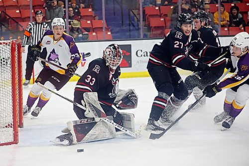 03032023
Ben Thornton #28 of the Brandon Wheat Kings tries to get the puck past goalie Chase Wutzke #33 of the Red Deer Rebels during WHL action at Westoba Place on Friday evening. 
(Tim Smith/The Brandon Sun)