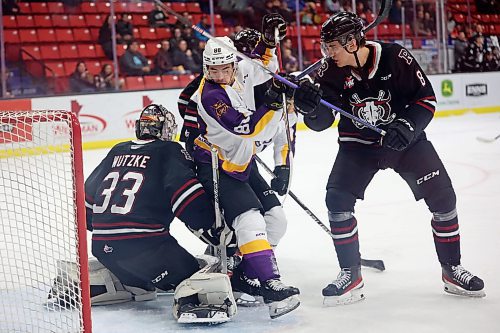 03032023
Dawson Pasternak #88 of the Brandon Wheat Kings gets tripped up in front of goalie Chase Wutzke #33 the Red Deer Rebels during WHL action at Westoba Place on Friday evening. 
(Tim Smith/The Brandon Sun)