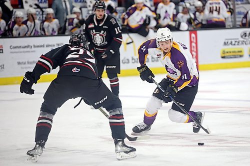 03032023
Rylen Roersma #11 of the Brandon Wheat Kings plays the puck around Mats Lindgren #11 of the Red Deer Rebels during WHL action at Westoba Place on Friday evening. 
(Tim Smith/The Brandon Sun)