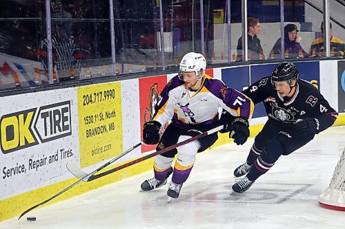 03032023
Zakhar Polshakov #71 of the Brandon Wheat Kings tries to keep the puck away from Christoffer Sedoff #4 of the Red Deer Rebels during WHL action at Westoba Place on Friday evening. 
(Tim Smith/The Brandon Sun)