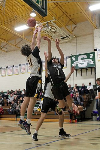 Felip Elizalde hit some tough shots, including this floater against a Torchbearers double-team. (Thomas Friesen/The Brandon Sun)