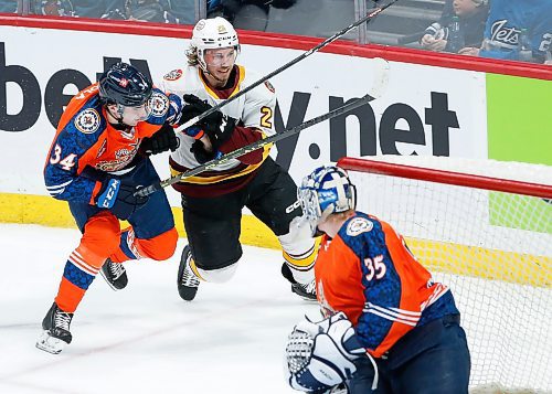 JOHN WOODS / WINNIPEG FREE PRESS
Manitoba Moose Ville Heinola (34) and Chicago Wolves’ Nathan Sucese (25) chase a loose puck during second period AHL action in Winnipeg on Sunday, March 5, 2023.

Reporter: ?