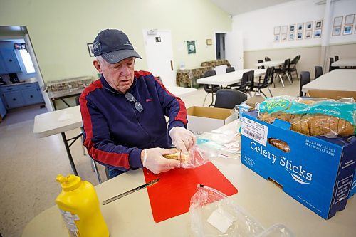 MIKE DEAL / WINNIPEG FREE PRESS
Campbell McIntyre, 75, volunteers with numerous organizations including Gifts of Grace Street Mission, Rainbow Stage and his church, St. Saviours Anglican, where he was making sandwiches Thursday afternoon.
230302 - Thursday, March 02, 2023.