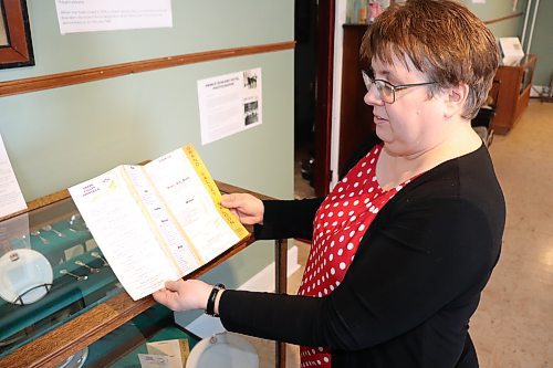 Eileen Trott shows off some Prince Edward Hotel artifacts at the Daly House Museum Saturday afternoon in Brandon. (Kyle Darbyson/The Brandon Sun)