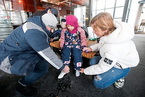 JOHN WOODS / WINNIPEG FREE PRESS
Andrii, Oryna and Svitlana Bganka, from Ukraine, get ready for a skate at the Forks Sunday, March 5, 2023. 

Re: piche