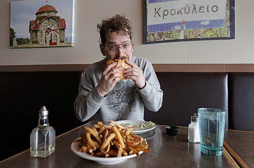 RUTH BONNEVILLE / WINNIPEG FREE PRESS
Richard Caron, who runs the Instagram account, For the Love of All Fat Boys, taste-tests a fat boy hamburger at Original George’s Burgers & Subs on St. Mary’s Road. 