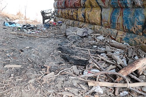 TYLER SEARLE / WINNIPEG FREE PRESS

Charred wood and debris marked the remains of an encampment beneath a bridge in the Point Douglas neighbourhood. March, 8, 2023. 