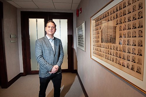 Mike Sudoma/Winnipeg Free Press
Llorne Remillard with framed pictures of some of the earliest Winnipeg Chamber off Commerce presidents, dating back to the early 1900&#x2019;s 
March 7, 2023 