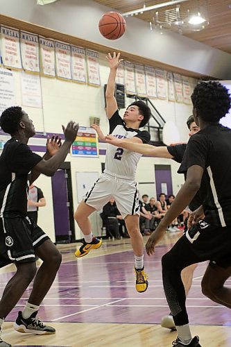 Vincent Massey Vikings Aaron Pasaporte shoots a floater against the Vincent Massey Trojans during the first round of AAAA varsity boys' basketball provincials on Thursday. (Thomas Friesen/The Brandon Sun)