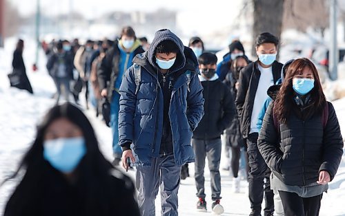 JOHN WOODS / WINNIPEG FREE PRESS

Outside Sisler High School students leave for the day, Monday, March 7, 2022. March 15th sees Manitoba’s COVID-19 mask protocols change and results in masks not being mandatory.
