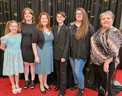 (Left to right) Addison Bouchard, Brigitte Tichit, Danielle Tichit, Jessica Tichit, Kennedy Baker and Marnie Marcischuk pose for a photo during the Women of Distinction Awards on Thursday evening at the Western Manitoba Centennial Auditorium. (Mariah Phillips, for The Brandon Sun)