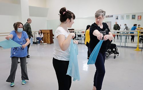 RUTH BONNEVILLE / WINNIPEG FREE PRESS 

ENT - RWB ExplorAbility

Jacqui Ladwig, the instructor/co-ordinator, gives direction to Daphne how to swirl around a scarf  creating interesting moves while dancing in RWB's  ExplorAbility Class on Wednesday. 

Subject:  ExplorAbility class at the RWB. This program aims to make dance more accessible with classes tailored to those diagnosed with Parkinson&#x573; and neurodiverse adults. Will be dropping in on the latter class today to observe and interview students and Jacqui Ladwig, the instructor/co-ordinator.  

See story by Eva Wasney


March 10th, 2023
