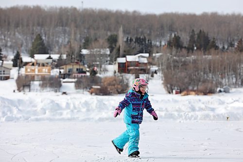 10032023
Five-year-old Claire Dagg ice skates on Minnedosa Lake with her grandfather Tom Instance on a mild Friday. (Tim Smith/The Brandon Sun)