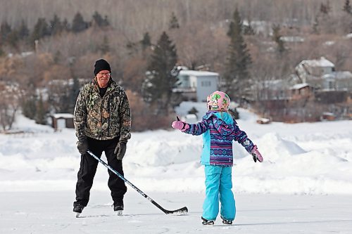 10032023
Five-year-old Claire Dagg ice skates on Minnedosa Lake with her grandfather Tom Instance on a mild Friday. (Tim Smith/The Brandon Sun)