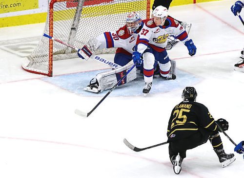 Brandon Wheat Kings forward Nolan Flamand (25) fires the puck over the blocker of Edmonton Oil Kings goalie Kolby Hay (30) and into the net as defenceman Reid Larsen (37) looks on in Western Hockey League action at Westoba Place on Saturday. (Perry Bergson/The Brandon Sun)