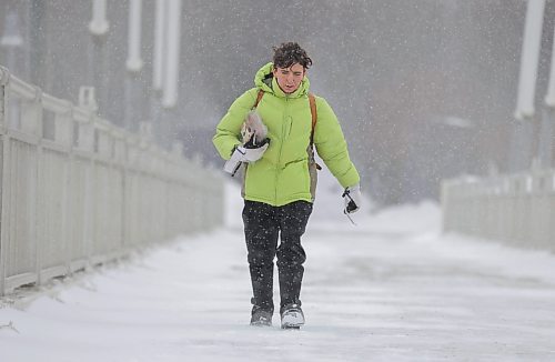 RUTH BONNEVILLE / WINNIPEG FREE PRESS 

Weather Standup - Blowing snow

Parker Koepnick walks across the Esplanade Riel Bridge against blowing snow from the Forks Saturday. 

March 11th, 2023

