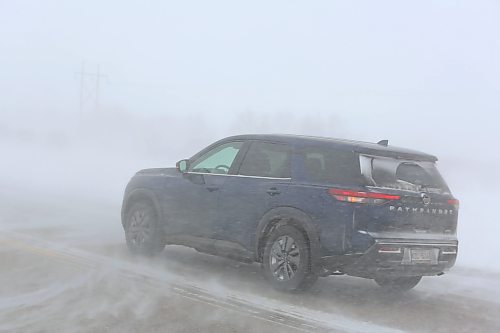 A motorist drives south on Highway 10, heading toward Brandon, during a major Saturday afternoon snowstorm that severely reduced visibility for those travelling in southern Manitoba outside of major urban areas. (Kyle Darbyson/The Brandon Sun)