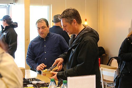 Brandon city councillors Jason Splett and Greg Hildebrand sample some of Edo Japan's menu items during the chain restaurant's grand opening ceremony for its new Brandon location, which took place this past Saturday at the Corral Centre. (Kyle Darbyson/The Brandon Sun) 