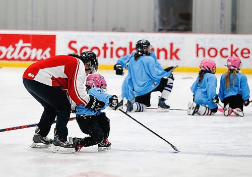 JOHN WOODS / WINNIPEG FREE PRESS
Cassie Campbell helps a young get to her feet after she fall at Girls Hockeyfest at Hockey For All Centre Sunday, March 12, 2023. 

Re: ?