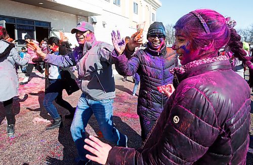 JOHN WOODS / WINNIPEG FREE PRESS
Arpit Pandey, from left, his partner Manisha and their daughter Rajiv, celebrate with friends at Holi festivities at the Hindu Temple on St Anne&#x2019;s Road Sunday, March 12, 2023. 

Re: ?
