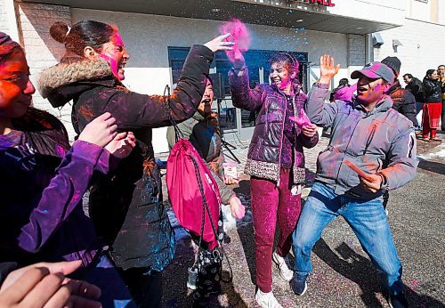 JOHN WOODS / WINNIPEG FREE PRESS
Arpit Pandey, right, and his daughter Rajiv, second right, celebrate with friends at Holi festivities at the Hindu Temple on St Anne&#x2019;s Road Sunday, March 12, 2023. 

Re: ?