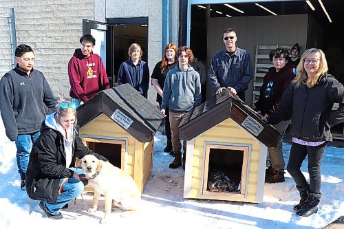 Volunteers from the Paws Crossed Animal Shelter dropped by Crocus Plains Regional Secondary School on Monday afternoon to pick up some dog houses that were built by local carpentry students. (Kyle Darbyson/The Brandon Sun)