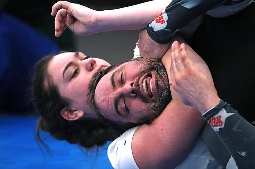 Nia Aitken sinks in a choke on father Ren Bouchard during a recent Brazilian jiu-jitsu training session at WAMMA Brandon. Both will be on the upcoming Brandon Bouts 1: Submission Only Grappling show at Western Manitoba Centennial Auditorium on April 1. (Perry Bergson/The Brandon Sun)