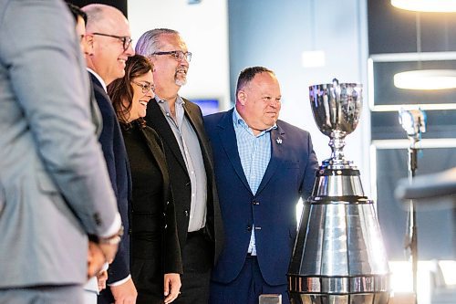 MIKAELA MACKENZIE / WINNIPEG FREE PRESS

President and CEO of the Winnipeg Football Club Wade Miller and other dignitaries pose for a photo with the Grey Cup at a press conference announcing Grey Cup 2025 at IG Field in Winnipeg on Tuesday, March 14, 2023. For Jeff story.

Winnipeg Free Press 2023.