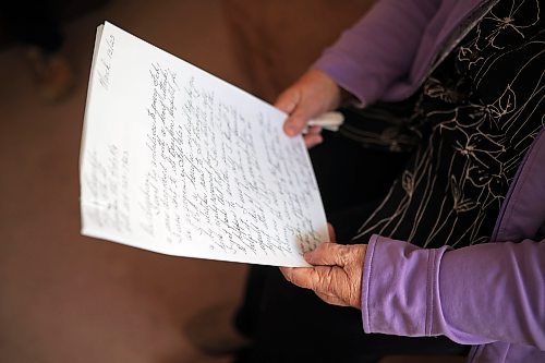 Eleanor Buechler, 79, reads over her notes about an awful ambulance and air ambulance trip to Winnipeg back in February, while sitting in her home in Brandon on Tuesday.  (Tim Smith/The Brandon Sun)