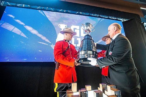 MIKAELA MACKENZIE / WINNIPEG FREE PRESS

RCMP take the Grey Cup away after a press conference announcing Grey Cup 2025 at IG Field in Winnipeg on Tuesday, March 14, 2023. For Jeff story.

Winnipeg Free Press 2023.