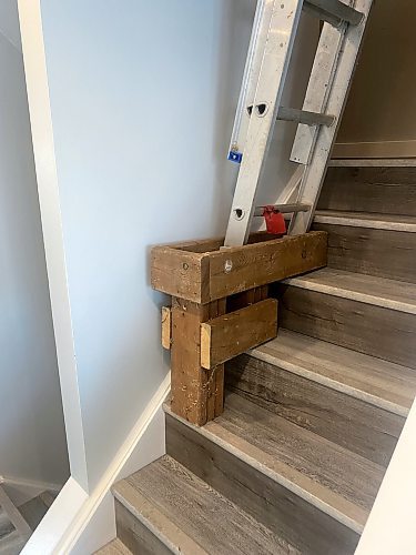 Photos by Marc LaBossiere / Winnipeg Free Press
Fashioned from remnant treated lumber nearly a decade ago, Marc's little stair helper continues to serve by providing a level and rigid support for his ladder.