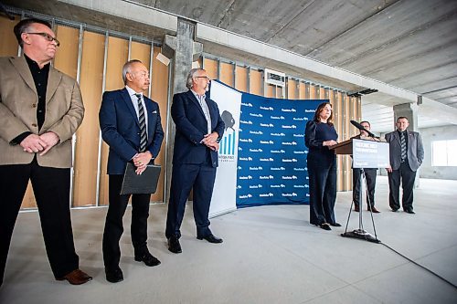 MIKAELA MACKENZIE / WINNIPEG FREE PRESS

Premier Heather Stefanson announces new funding for the Manitoba Venture Capital Fund at their soon-to-be headquarters on Lorimer as Larry Davey (left), Grant Kook, Mike Pyle, Jeff Wharton, and Wayne Ewasko listen in Winnipeg on Wednesday, March 15, 2023. For Marty story.

Winnipeg Free Press 2023.