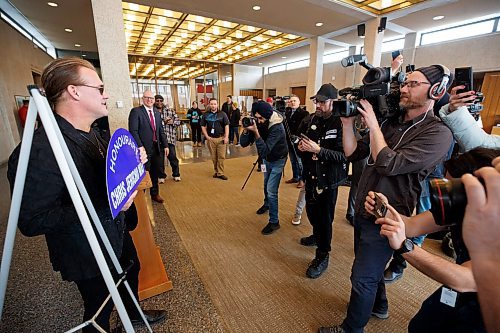 MIKE DEAL / WINNIPEG FREE PRESS
Mayor Scott Gillingham presents Chris Jericho with a street named after him during a presentation at City Hall Wednesday morning.
230315 - Wednesday, March 15, 2023.